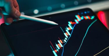 analyzing trading data on digital tablet